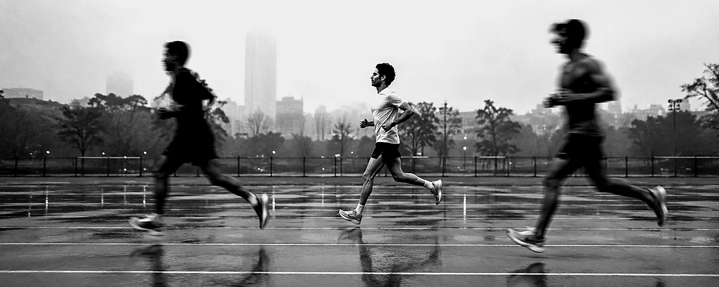 Animated monochrome runners moving through a track study